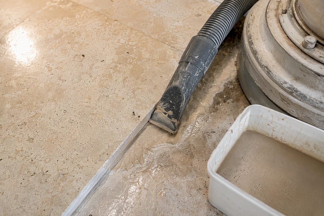 Wet vacuum removing limestone polishing slurry