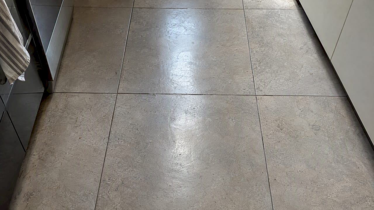 Shiny wear patch on matte textured tile