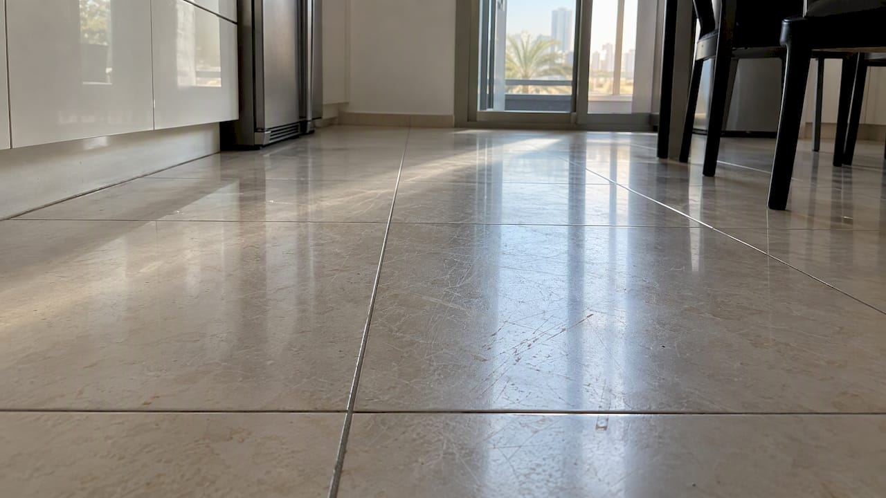 Fine scratches dull a porcelain tile floor